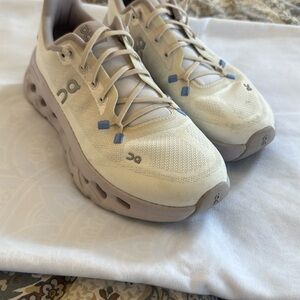 On Running Cream and Tan Sneakers